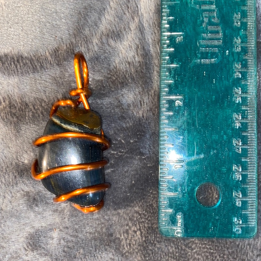 Black stone with copper wire pendent